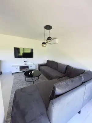 a living room with a couch and a table at Nature flow Bihac in Otoka