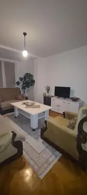 a living room with a couch and a table at Ali app in Travnik