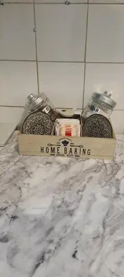 a sign that says home baking sitting on a counter at Ali app in Travnik