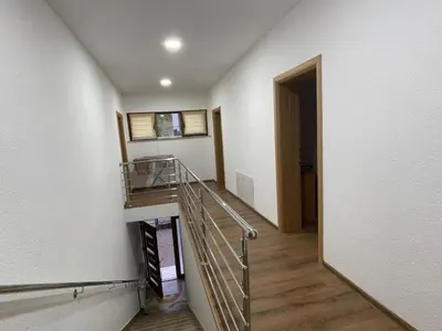 a staircase in a house with a stair case at EDina Apartman in Bihać