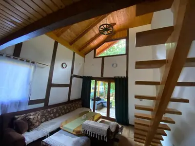 a living room with a couch and a window at UNA Dream in Bihać