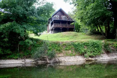 a house on top of a hill next to a river at Holiday home Alen in Kulen Vakuf
