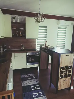 a kitchen with a stove and a counter top at Holiday home Alen in Kulen Vakuf