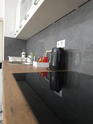 a kitchen with a counter with a coffee maker on it at Lux Una City in Bihać