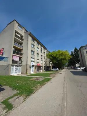 an empty street in front of a building at Lux Una City in Bihać