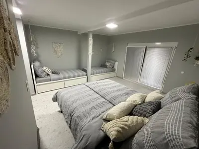 a bedroom with two beds and a large mirror at Una Hacienda in Bihać