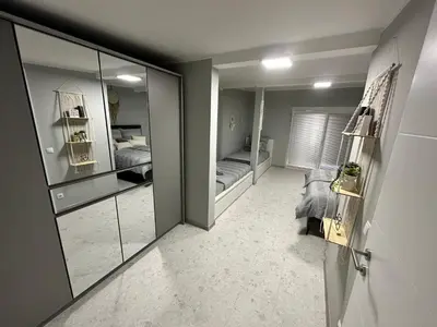 a room with mirrors and a bedroom with two beds at Una Hacienda in Bihać