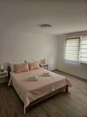 a bedroom with a large bed with two towels on it at Jelena in Jajce