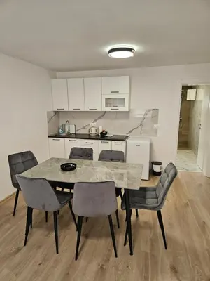 a kitchen and dining room with a table and chairs at Jelena in Jajce