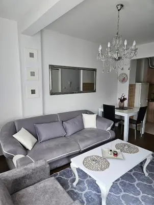 a living room with a couch and a table at Comfort u blizini Klinickog Centra Banja Luka in Lauš