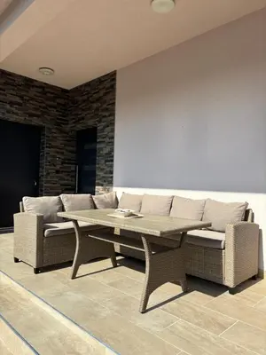 a living room with a couch and a table at Villa Aurea in Bihać