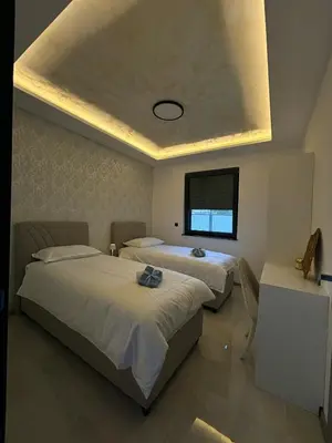 a bedroom with two beds and a window at Villa Aurea in Bihać