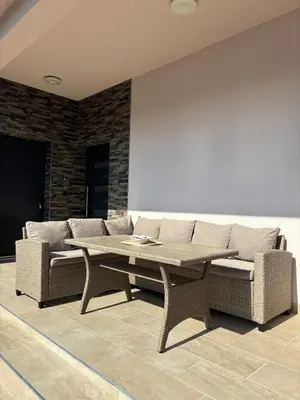 a living room with a couch and a table at Villa Aurea in Bihać