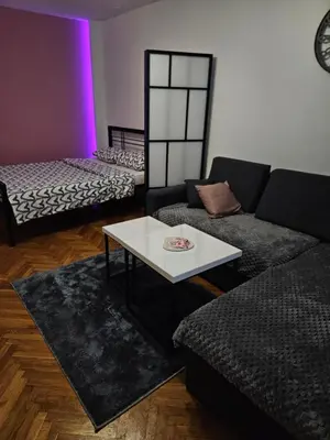 a living room with a couch and a table at Apartman Maja in Bosanski Šamac