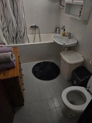 a bathroom with a toilet and a tub and a sink at Apartman Maja in Bosanski Šamac