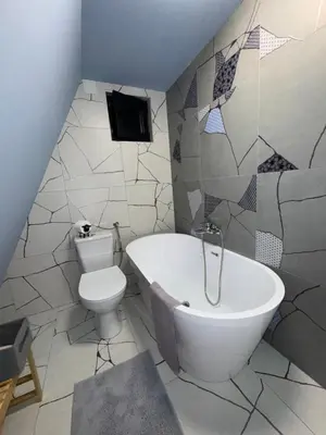 a bathroom with a toilet and a bath tub at Villa Šašava in Bosanska Gradiška