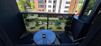 a blue table in a room with a window at Apartment Lazarus with garage Banja Luka in Banja Luka