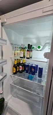 an open refrigerator filled with lots of condiments at Apartment Lazarus with garage Banja Luka in Banja Luka