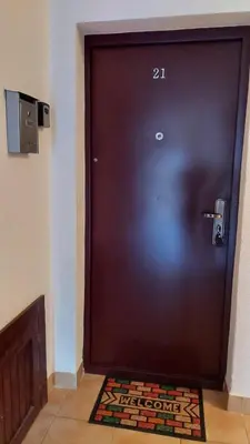 a brown door with the number on it at Apartman Vlašićki san in Vlasic