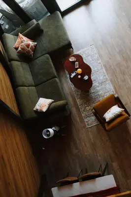 an overhead view of a living room with a green couch at Villa Natura in Bosanska Gradiška