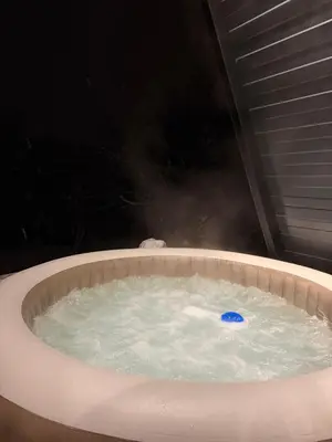 a hot tub with a blue ball in it at Villa Natura in Bosanska Gradiška