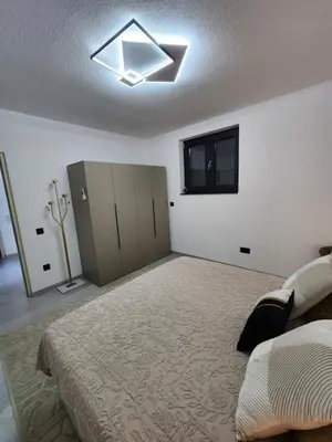 a bedroom with a bed and a ceiling fan at La Villa Luxury Home Bihac in Bihać