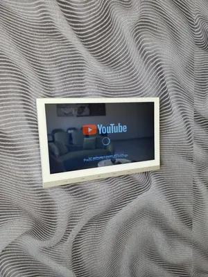 a television sitting on top of a bed at La Villa Luxury Home Bihac in Bihać