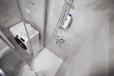 a bathroom with a shower with a toilet and a sink at Dolce notte in Železnička Stanica Incel