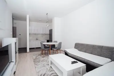 a living room with a couch and a table at Dolce notte in Železnička Stanica Incel