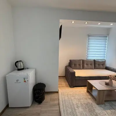 a living room with a couch and a table at Apartmani Vanilla in Zavidovići