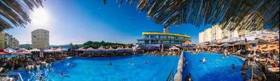 a large swimming pool with many people in it at Hostel Fortuna in Banja Luka