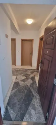 an empty room with a door and a hallway at Apartman Ivan in Tomislavgrad