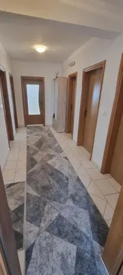 an empty room with a hallway with doors at Apartman Ivan in Tomislavgrad