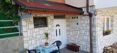 a small house with a table in front of it at Bella vista in Jajce