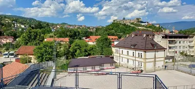 a view of a city with a large building at Bella vista in Jajce