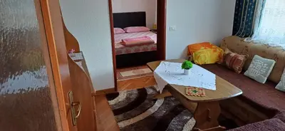 a small room with a table and a mirror at Bella vista in Jajce