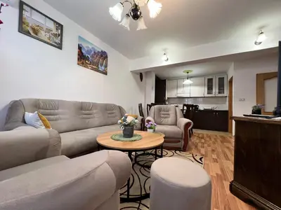 a living room with a couch and a table at GRADINA - Stan na dan in Doboj