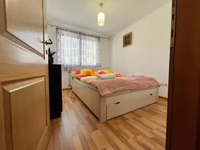 a bedroom with a bed and a window at GRADINA - Stan na dan in Doboj