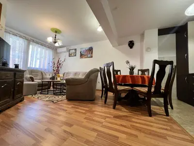 a living room with a table and chairs at GRADINA - Stan na dan in Doboj
