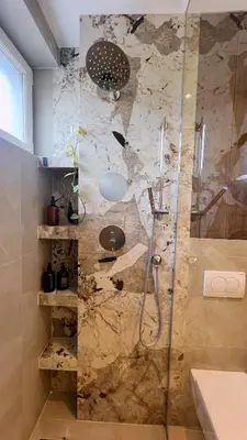 a bathroom with a shower with a glass door at Banja Luka Apartment Brigita in Banja Luka