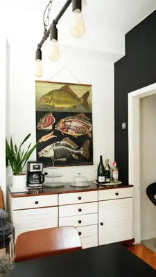a painting of fishes on the wall in a room at Banja Luka Apartment Brigita in Banja Luka
