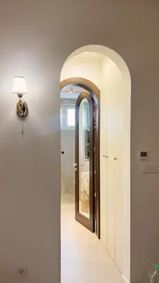 a hallway with an archway and a mirror at Banja Luka Apartment Brigita in Banja Luka