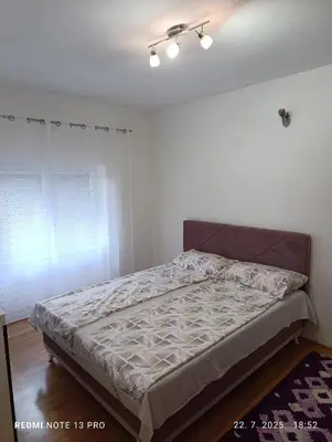 a bedroom with a bed in a room at Apartman Omar in Bihać