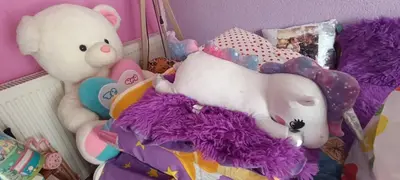 a pile of stuffed animals sitting on a bed at Gajanka in Bugojno