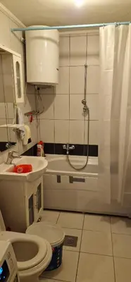 a bathroom with a shower and a toilet and a sink at Apartment Plava Voda in Travnik