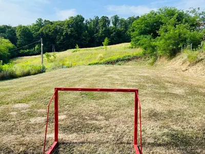 a red goal in the middle of a field at Vikendica Bregovi in Doboj
