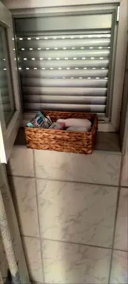 a basket sitting on the floor in a room at Vikendica Bregovi in Doboj