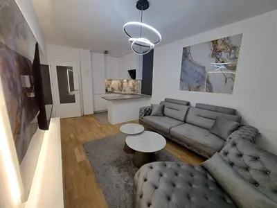 a living room with a couch and a table at Apartman So Chic kod Kastela in Banja Luka