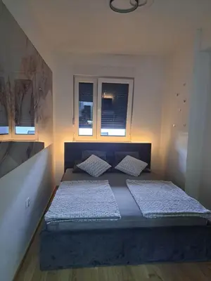 a bedroom with a bed with two pillows on it at Apartman So Chic kod Kastela in Banja Luka