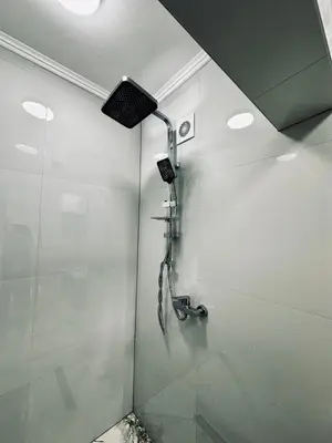 a shower with a shower head in a bathroom at Apartment Casa Deluxe in Visoko
